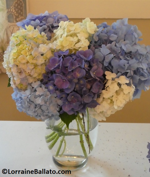 Vase stuffed with cut hydrangeas